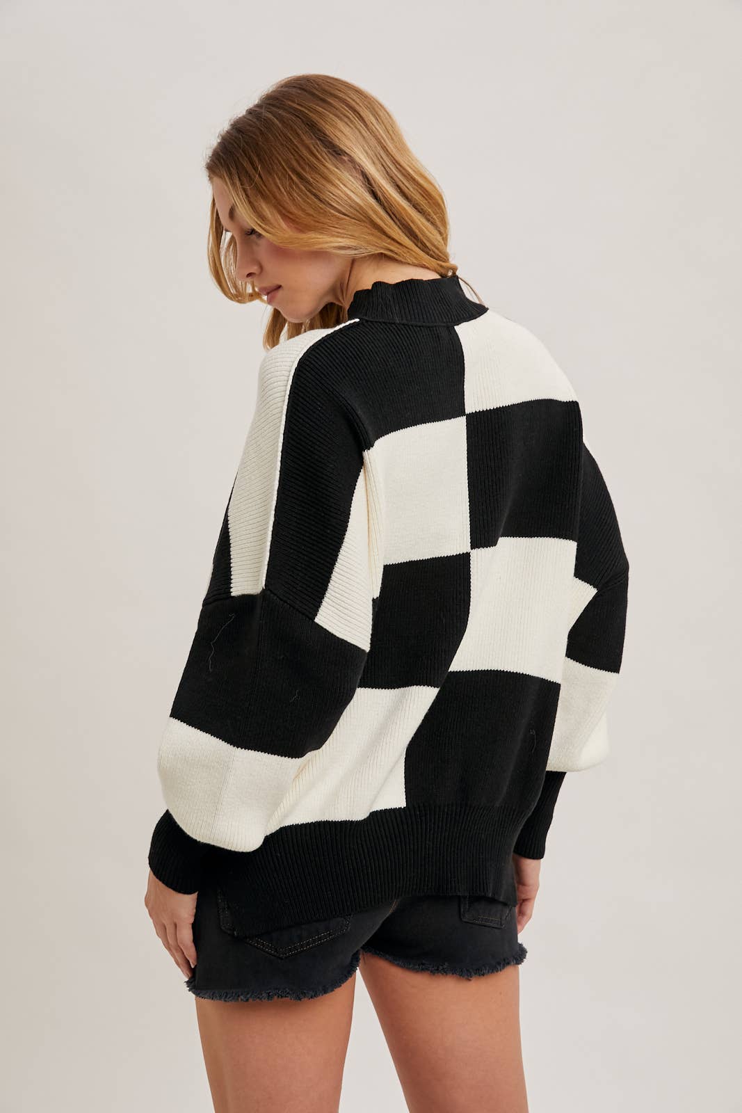 CHECKMATE KNIT SWEATER