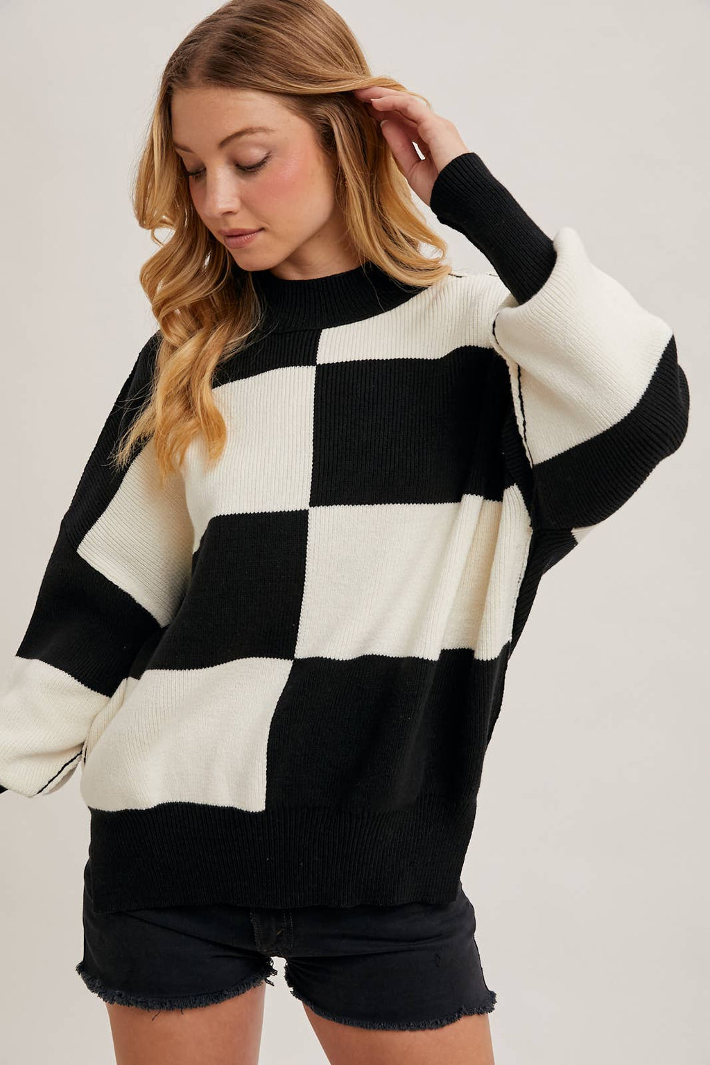 CHECKMATE KNIT SWEATER